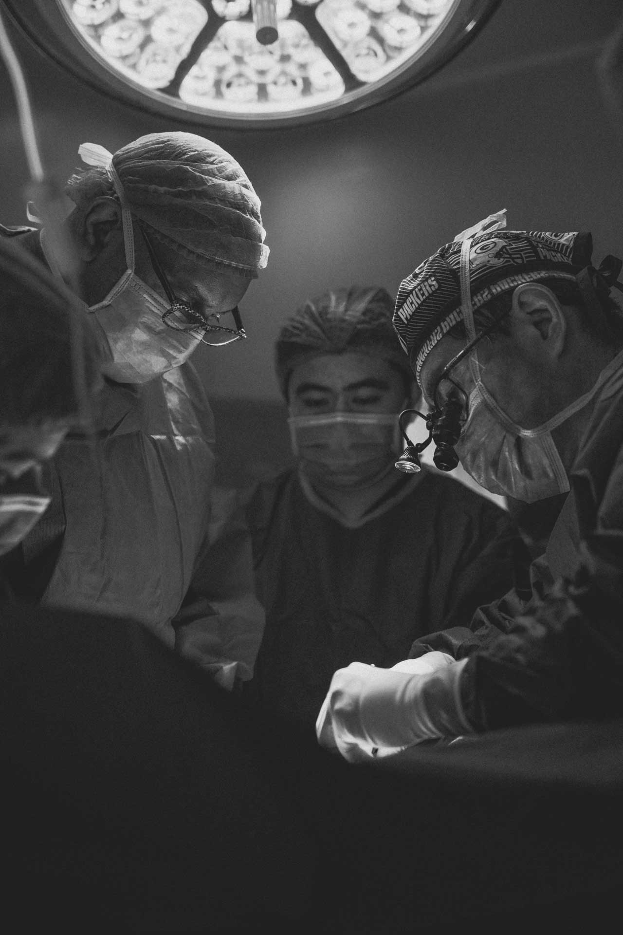 Black And White Image Of Surgeons Performing A Surgery