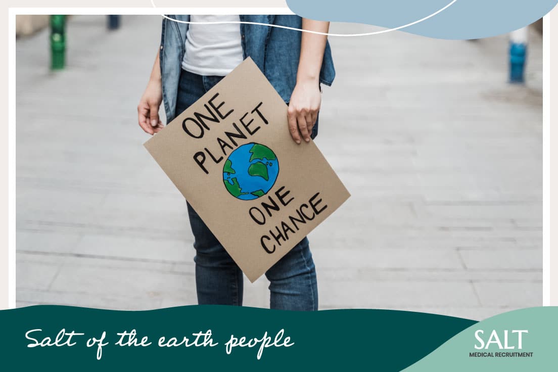Person Holding A Cardboard Sign That Says ONE PLANET ONE CHANCE